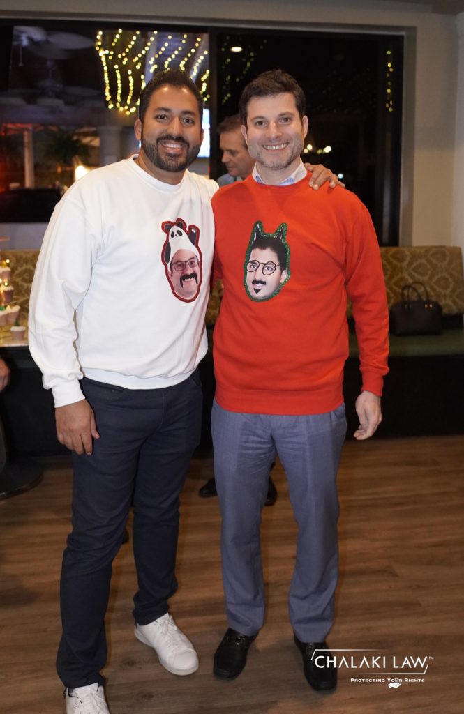 Shawn Hashemi and Sean Chalaki posing in a sweater