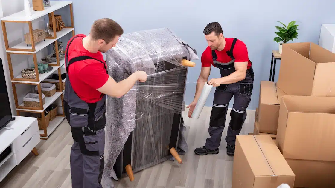 Moving company packing furniture