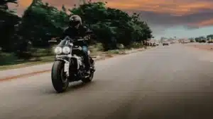 Guy Riding A Motorcycle On An Open Road